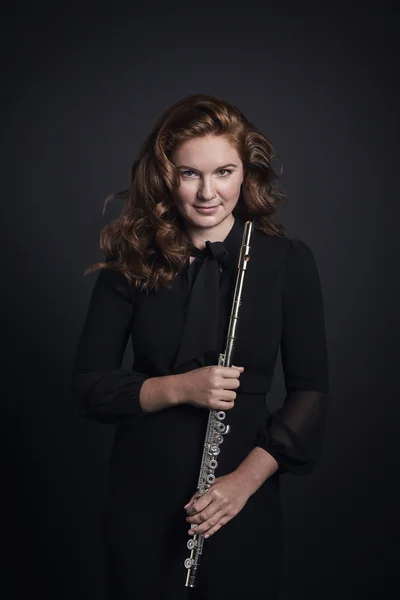 Photo of Ariane Brisson holding her flute